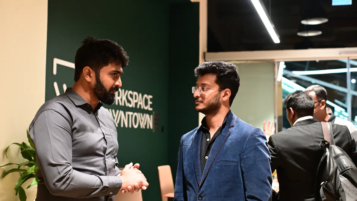 Two founders in a focused one-to-one discussion