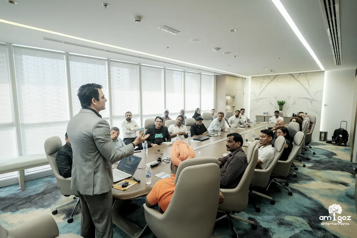 A founder leading a focused strategy discussion around a private boardroom table