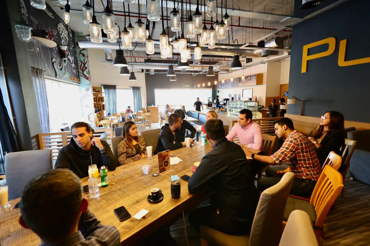 Founders and business leaders in a relaxed table conversation